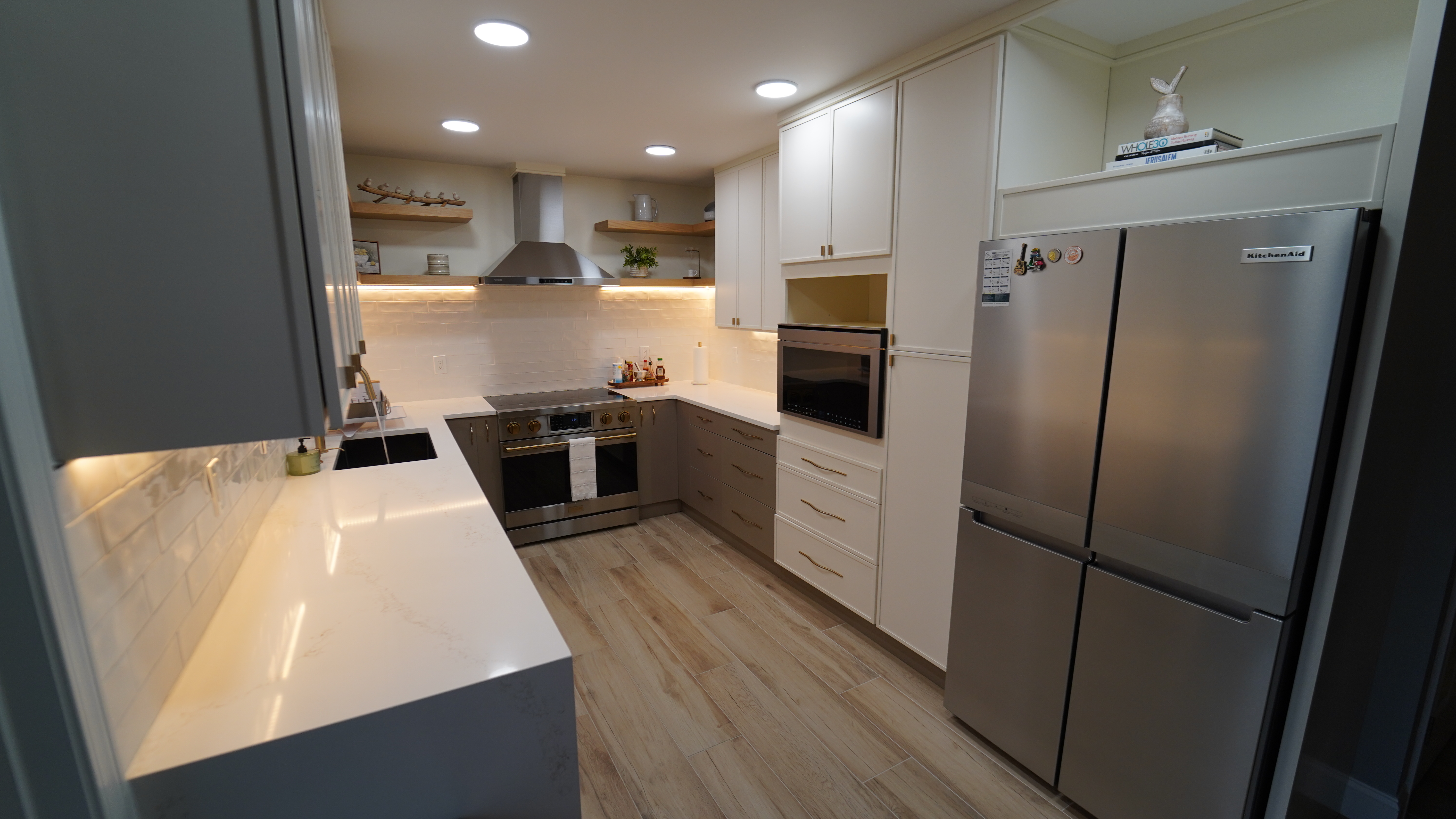 Saugus MA kitchen appliance wall with refrigerator, oven, and tall storage